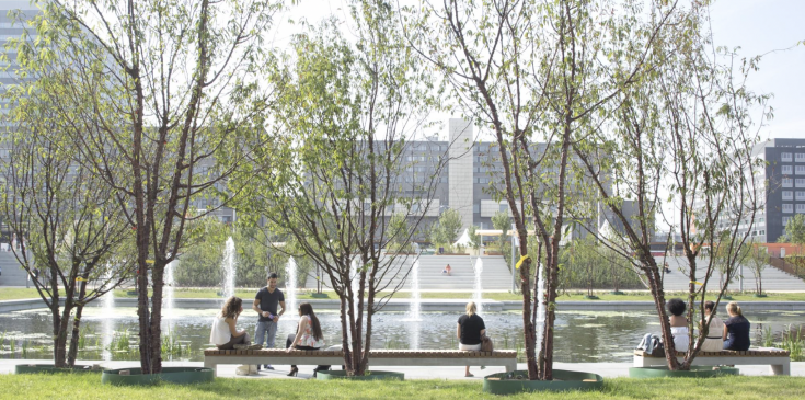 View of people sitting in front of a fountain